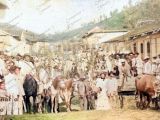 Carnavales de la Guarenas de antaño en la calle Real, década de 1920. Al fondo, esquina de la calle Bermúdez. Fotografía restaurada y coloreada digitalmente por Campanario Urbano.