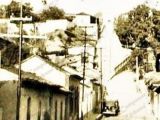 A la derecha, antigua casa del Cine Guarenas, calle Comercio con calle El Parque, década 1920. Al lado, Tienda La Moderna